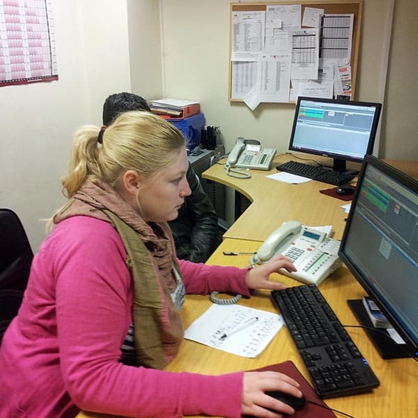 A Western Cars controller working in the office
